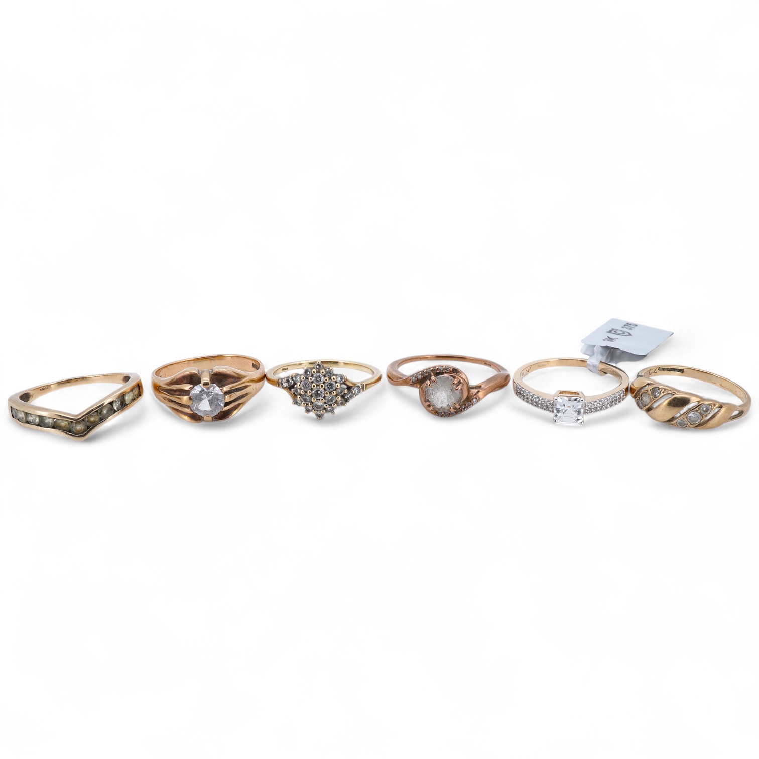 Six gem-set rings, comprising: one set with brilliant-cut diamonds; four set with colourless simulant diamonds; and one set with circular-cut peridots, each mounted in 9ct gold, British hallmarks, combined gross weight a